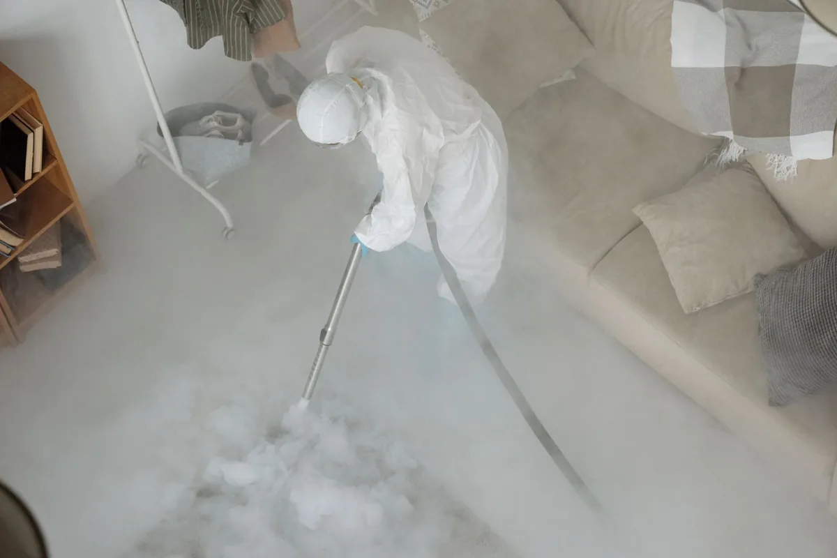 Biohazard cleanup technician in protective equipment, Pittsburgh, PA